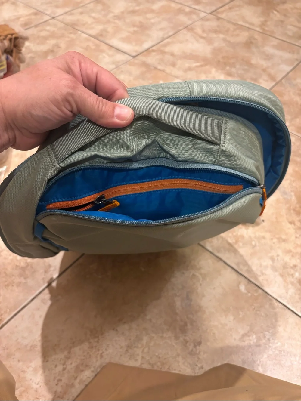 cotopaxi sage green backpack with blue trim
